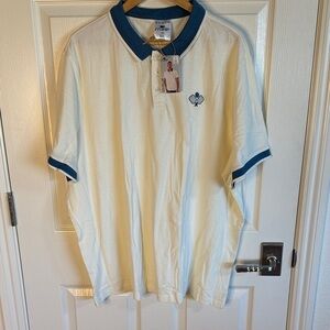 Men's Cream Polo with Blue Trim. Pickleball theme.